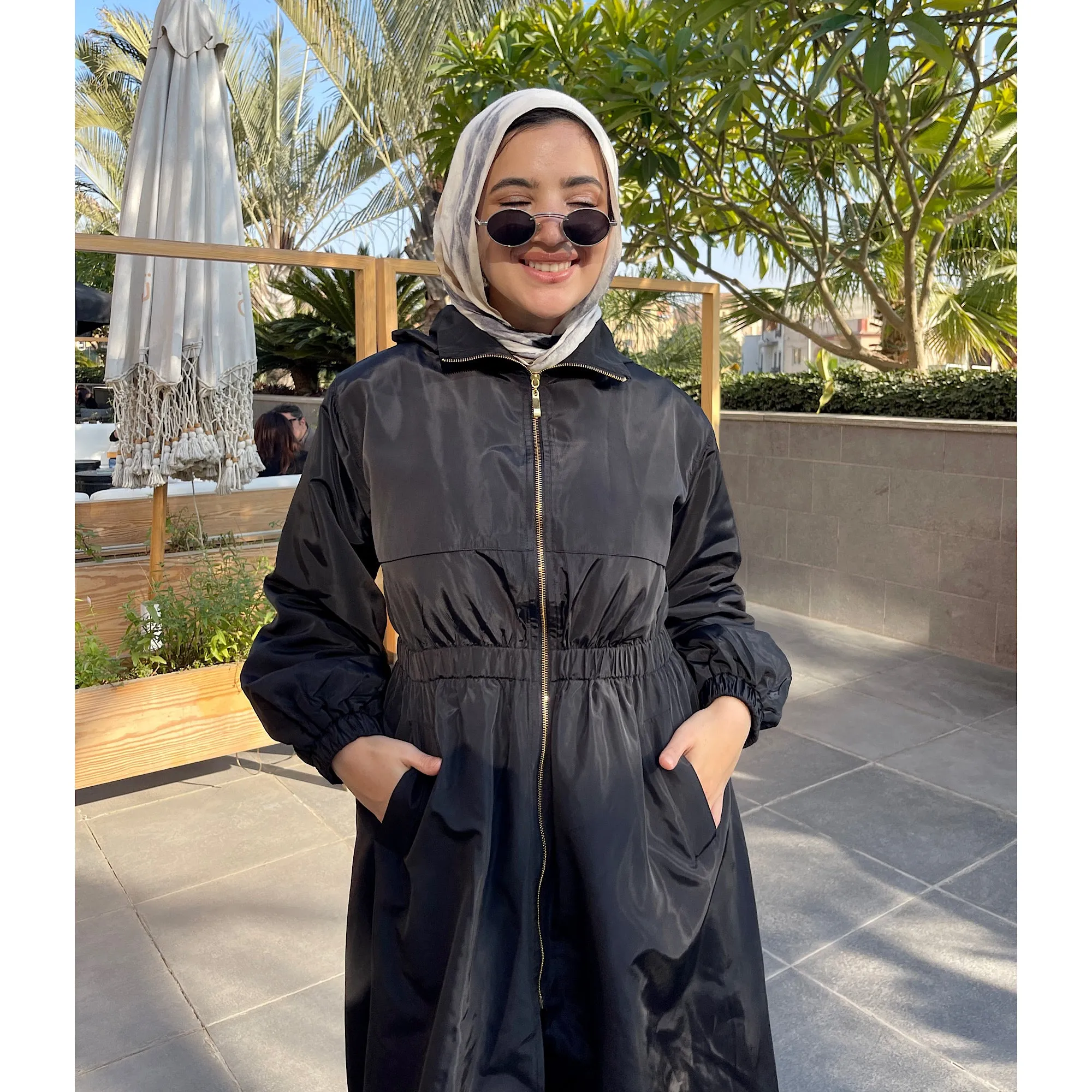 Long zipped black waterproof jacket